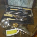 A cased carving set fish server and a ladle