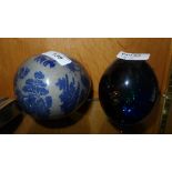 Two glass egg paperweights