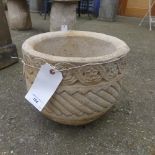 A pair of reconstituted stone planters of classical design