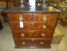 A two part late C17th walnut chest, having two short above three long drawers raised upon plinth