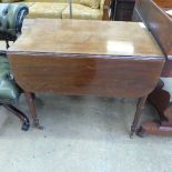 A C19th mahogany Pembroke table having twin rectangular flaps above end drawer on ring turned