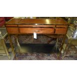 A fruitwood campaign style two tiered hall table with brass mounts