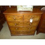 A Victorian figured walnut chest having two short above three long drawers raised upon bum feet