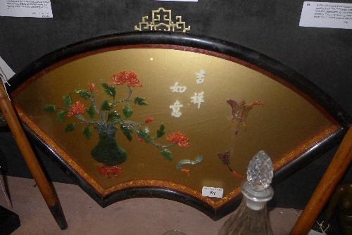 A Chinese hard stone and coral picture of vase of flowers within fan shaped ebonised frame