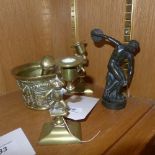 A mortar and pestle, two brass candlestick and a Grecian figure of the discobolus