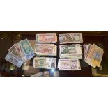 A collection of 100 various worldwide bank notes