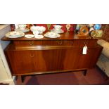 A 1960's designer sideboard fitted three