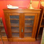 A Victorian walnut bookcase fitted pair