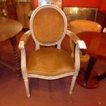 A pair of French white painted armchairs