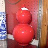 A Chinese double gourd vase with red gla