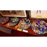 A set of four Maling hand painted plates