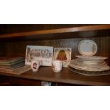A collection of commemorative items including plates, books and others