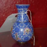 A Chinese Peking glass vase of small size with overlaid floral decoration
