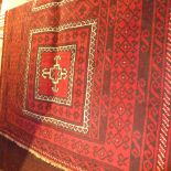 A fine North East Persian Turkoman rug 210 x 120 cm triple pole medallion on a rouge field within