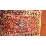 Two identical fine Persian Kashan rugs 160 x 92 cm and 158 x 110 cm bearing central floral medallion