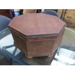 An octagonal hardwood garden storage box with lid