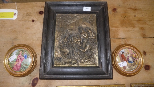 A religious spelter framed plaque and two porcelain painted oval pictures one titled Cries of