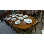 A yewood extending dining table and six matching chairs