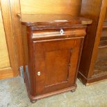 A mahogany serpentine cabinet with single drawer over panel door on plinth base