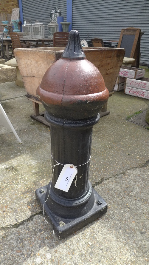 A pair of reconstituted painted stone reproduction bollard in the Victorian style.
