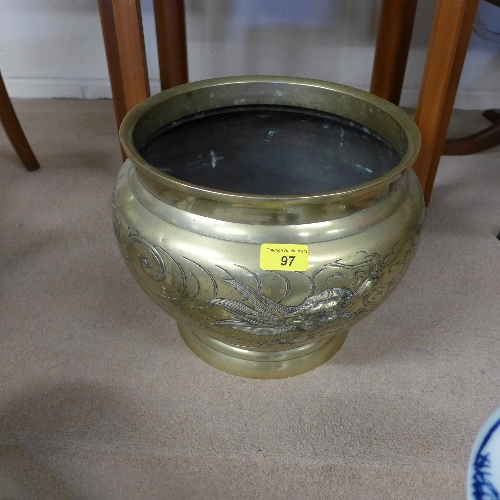 A brass Chinese style planter with dragon decoration