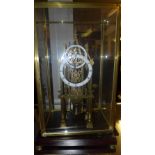 A cathedral skeleton clock with glass case