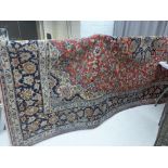 A fine central Persian Kashan carpet (350cm x 230cm) central floral pendant medallion with