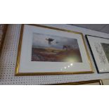 A limited edition print by Archibald Thorburn of pheasants flying over a morrland glazed and framed