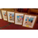 A set of four framed Suzan Wolters prints of beach scenes