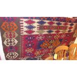 A hand knotted Kelim rug the multi coloured ground having geometric decoration