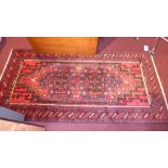 A fine North East Persian Hatchlie rug, 215cm x 108cm, double pole medallion on a rouge field within