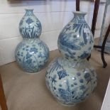 A pair of blue and white Chinese gourd style vases