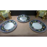 A set of three Oriental plates with bird decorated border
