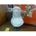A porcelain figure of a veiled lady