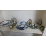 A collection of various assorted Chinese style porcelain with bowls and vases