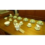 A Paragon bone china coffee service for four, celadon green with gilt detail,