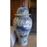 A pair of large Chinese style blue and white vases