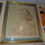 A large sepia drawing portrait of a lady framed and glazed