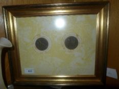 A framed pair of presentation sport medals