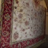 A Persian Keshan style carpet with a cen