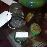 Two jadeite Chinese carved pendants and a bronze eagle head inkwell