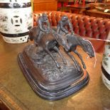 A bronzed figural group of two racing horses on a scenic base mounted on marble