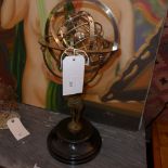 A bronze figure of Atlas supporting a celestial sphere on a marble base