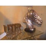 A chromium letter rack and a silvered horse bust