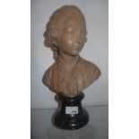 A terracotta bust of a classical composer on marble base