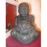 A C20th carved hard stone model of a seated Buddha signed to base