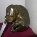 An Olivia Clifon Rligh bronze sculpture of a monkey, signed and numbered 1/9