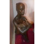 A composite bronzed figure of a seated female nude signed indinstinctly and dated '82 limited