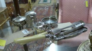 A collection of silver plated items including condiment pots and salt