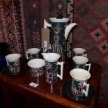 A Portmerion 'Magic City' pattern coffe set to sit six